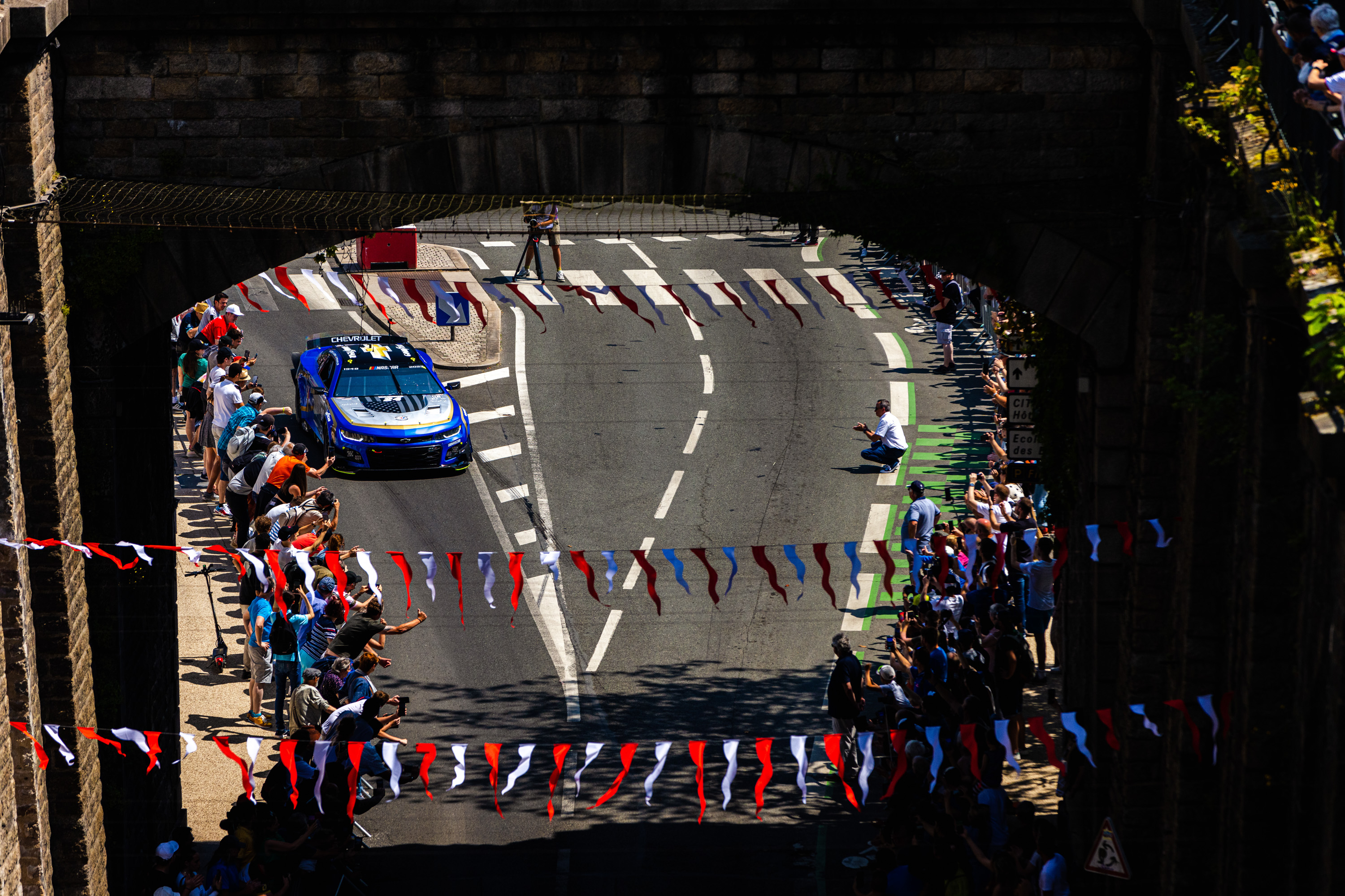 Jimmie Johnson at the wheel of the NASCAR in the streets of Le Mans. What a sight...  and sound!